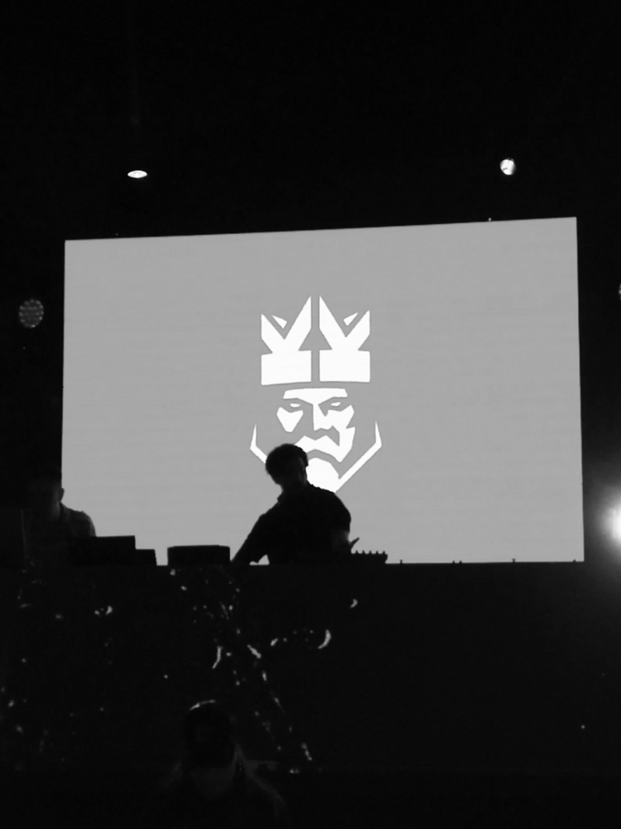 vbmusic DJ against the Kings League screen at their after party